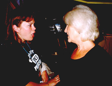 A conference participant gets her book signed by Barbara.